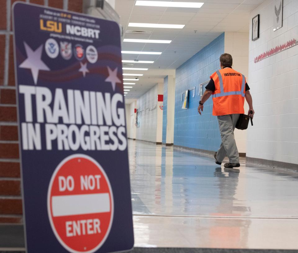 Mark Holley, a trainer with Louisiana State University, conducts an active shooter threat exercise at Woodlawn Beach Middle School in Gulf Breeze, Florida, on Oct. 14, 2019.