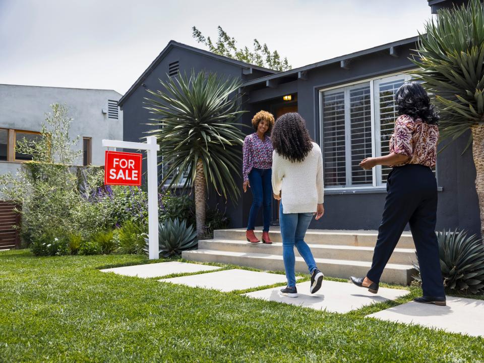 Potential homebuyers and a real estate agent.