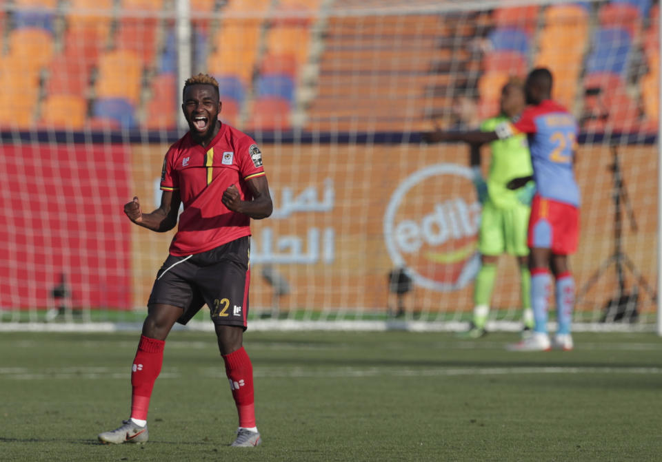 DR Congo's Chancel Mangulu Mbemba celebrates his team's second goal the African Cup of Nations group A soccer match between DR Congo and Uganda at Cairo International Stadium in Cairo, Egypt, Saturday, June 22, 2019. (AP Photo/Hassan Ammar)