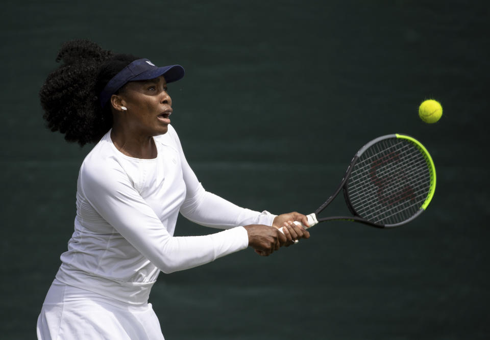 Venus Williams of the US practices on the practice courts at Wimbledon prior to the Wimbledon Tennis Championships in London, Saturday June 26, 2021. (David Gray/Pool via AP)