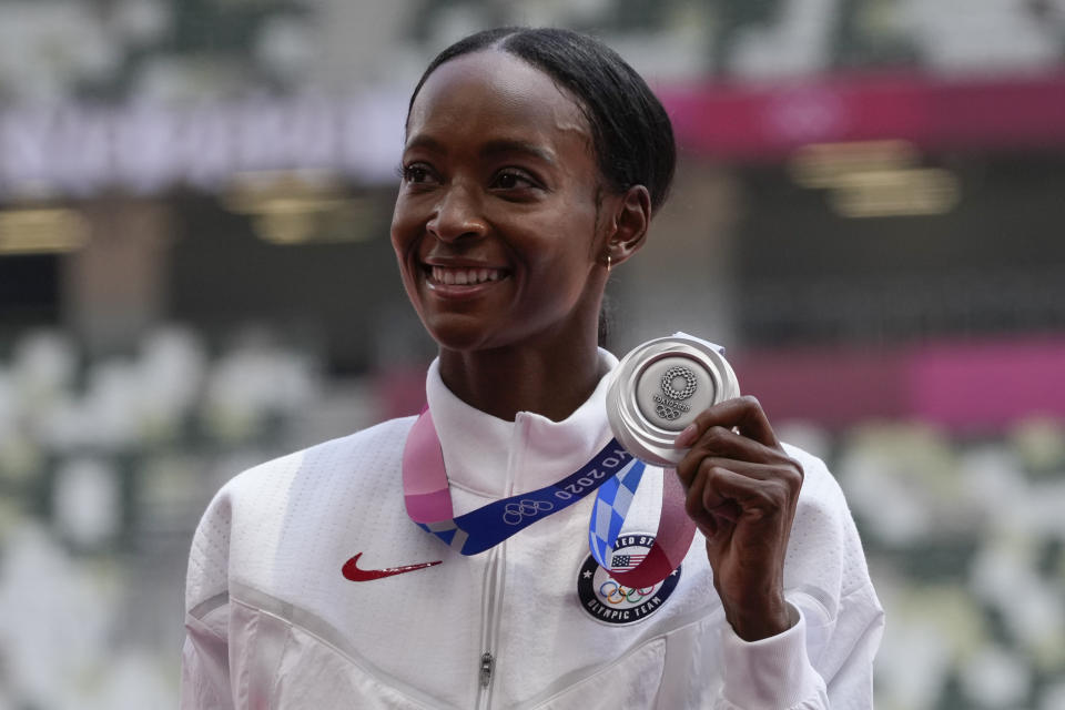 Silver medalist Dalilah Muhammad, of the United States, poses during the medal ceremony for the women's 400-meter hurdles at the 2020 Summer Olympics, Wednesday, Aug. 4, 2021, in Tokyo. (AP Photo/Francisco Seco)