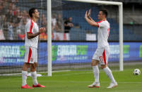 Soccer Football - International Friendly - Serbia vs Bolivia - Merkur-Arena, Graz, Austria - June 9, 2018 Serbia's Aleksandar Mitrovic celebrates with Filip Kostic after scoring their fifth goal to complete his hat-trick REUTERS/Heinz-Peter Bader