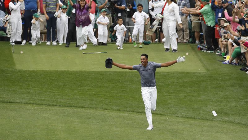 Tony Finau reacts after hitting a hole-in-one on the seventh hole during the par-3 contest at the Masters golf tournament Wednesday, April 4, 2018, in Augusta, Ga. What happened moments later wasn’t so wonderful.