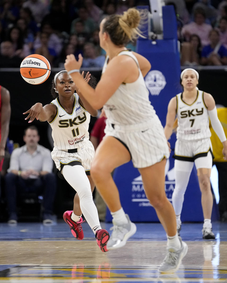 Chicago Sky's Dana Evans (11) starts the fast break with a pass to Marina Mabrey during the second half of a WNBA basketball game against the Atlanta Dream Wednesday, July 10, 2024, in Chicago. The Sky won 78-69. (AP Photo/Charles Rex Arbogast)