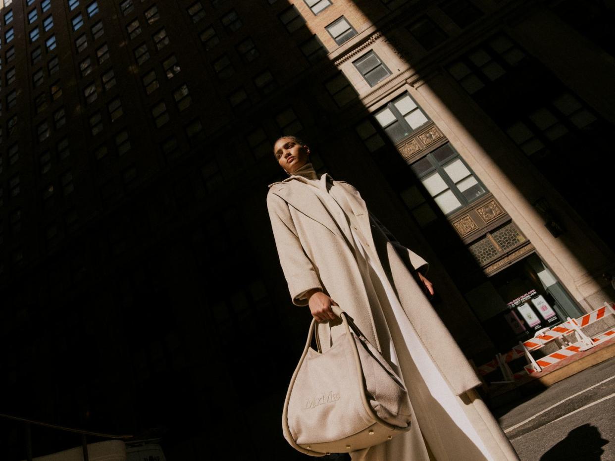 model in cream max mara coat