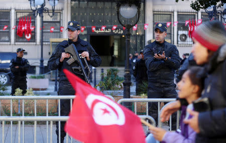 Police officers stand guard in front of the Ministry of the Interior during demonstrations on the seventh anniversary of the toppling of president Zine El-Abidine Ben Ali, in Tunis, Tunisia January 14, 2018. REUTERS/Zoubeir Souissi