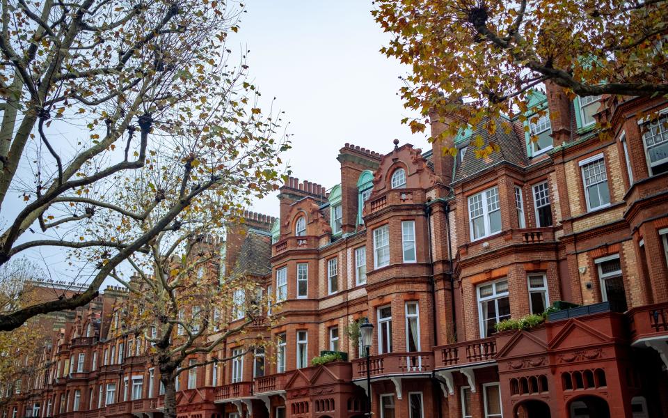 Mortgage  Attractive street of residential terraced mansion buildings in Kensington, West London