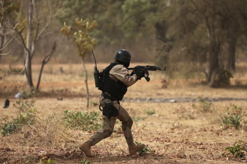 A soldier from Burkina Faso participates in a simulated raid during the U.S. sponsored Flintlock exercises in Ouagadougou, Burkina Faso