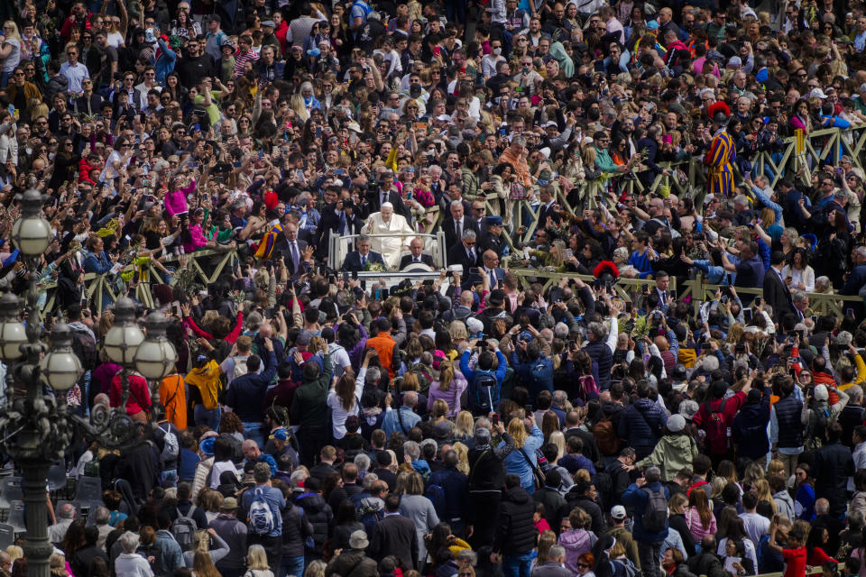 Pope Francis leaves after celebrating the Palm Sunday's mass in St. Peter's Square at The Vatican Sunday, April 2, 2023, a day after being discharged from the Agostino Gemelli University Hospital in Rome, where he has been treated for bronchitis, The Vatican said. The Roman Catholic Church enters Holy Week, retracing the story of the crucifixion of Jesus and his resurrection three days later on Easter Sunday. (AP Photo/Gregorio Borgia)