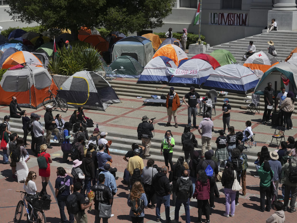 A speaker talks through a bullhorn at a pro-Palestinian protest camp set up on Sproul Plaza at the University of California, Berkeley, in Berkley, Calif., on Thursday, April 25, 2024. (Jim Wilson/The New York Times)