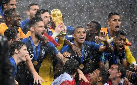 France's players lift the Fifa World Cup trophy after the Russia 2018 World Cup final  - Credit: AFP