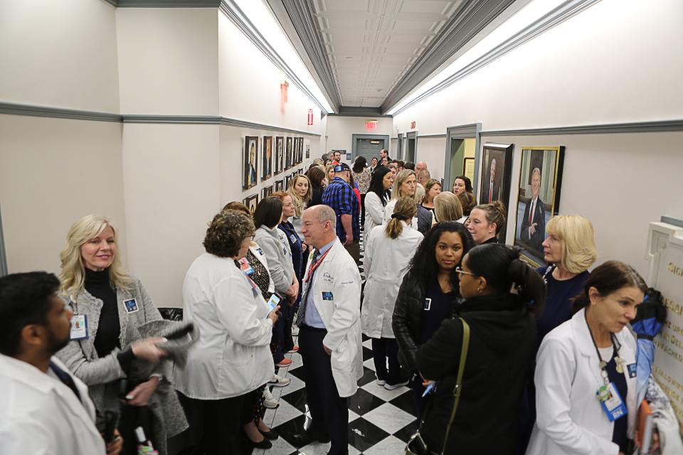 Dozens of healthcare workers wait in the hallways at Legislative Hall in Dover on Wednesday, March 27, 2024 ahead of a meeting on House Substitute 1 for House Bill 350.