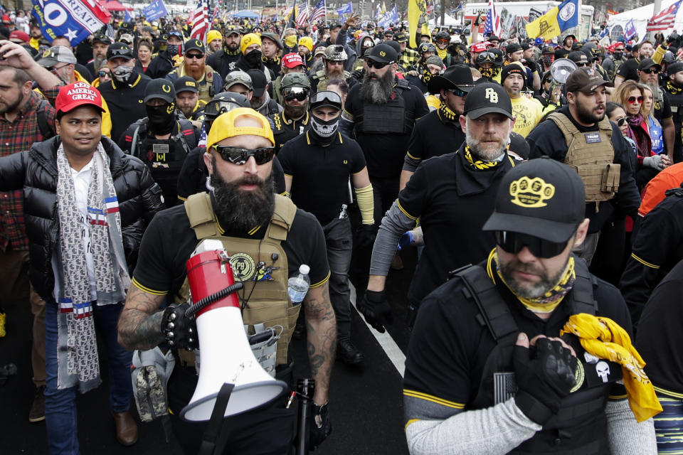 Far-right Proud Boys member Jeremy Joseph Bertino, second from left, joins other supporters of President Donald Trump who are wearing attire associated with the Proud Boys as they attend a rally at Freedom Plaza, Dec. 12, 2020, in Washington. Bertino pleaded guilty on Thursday, Oct. 6, 2022, to plotting with other members of the Proud Boys to violently stop the transfer of presidential power after the 2020 election, making him the first member of the extremist group to plead guilty to a seditious conspiracy charge. (AP Photo/Luis M. Alvarez, File)