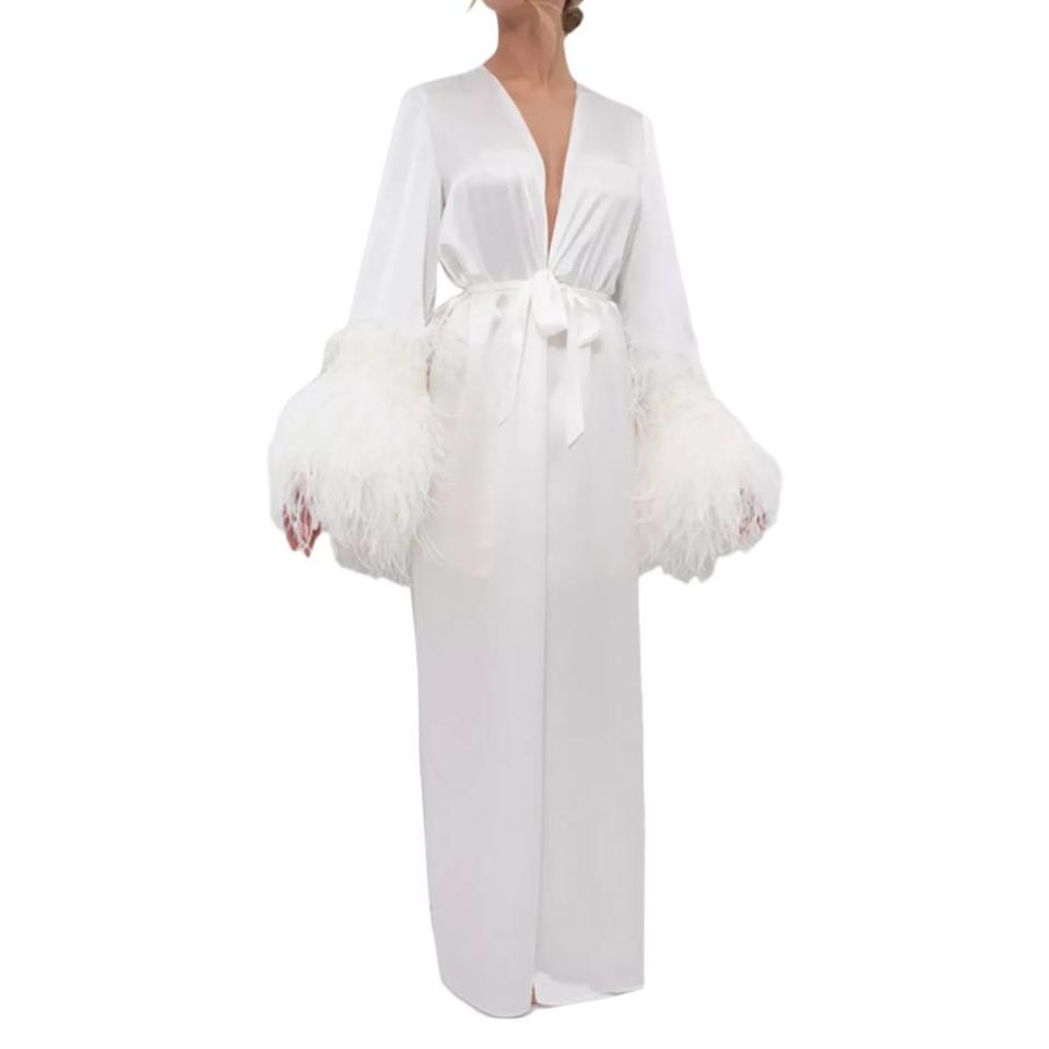 <p><a href="https://go.redirectingat.com?id=74968X1596630&url=https%3A%2F%2Fwww.macys.com%2Fshop%2Fproduct%2Fwomens-silk-long-robe-double-ostrich-feather-sleeve-trim-silk-collection%3FID%3D16658507&sref=https%3A%2F%2Fwww.elle.com%2Ffashion%2Fshopping%2Fa60246725%2Feditor-bridal-wedding-outfits%2F" rel="nofollow noopener" target="_blank" data-ylk="slk:Shop Now;elm:context_link;itc:0;sec:content-canvas" class="link ">Shop Now</a></p><p>Silk Long Robe, Double Ostrich Feather Sleeve Trim</p><p>macys.com</p><p>$828.00</p>