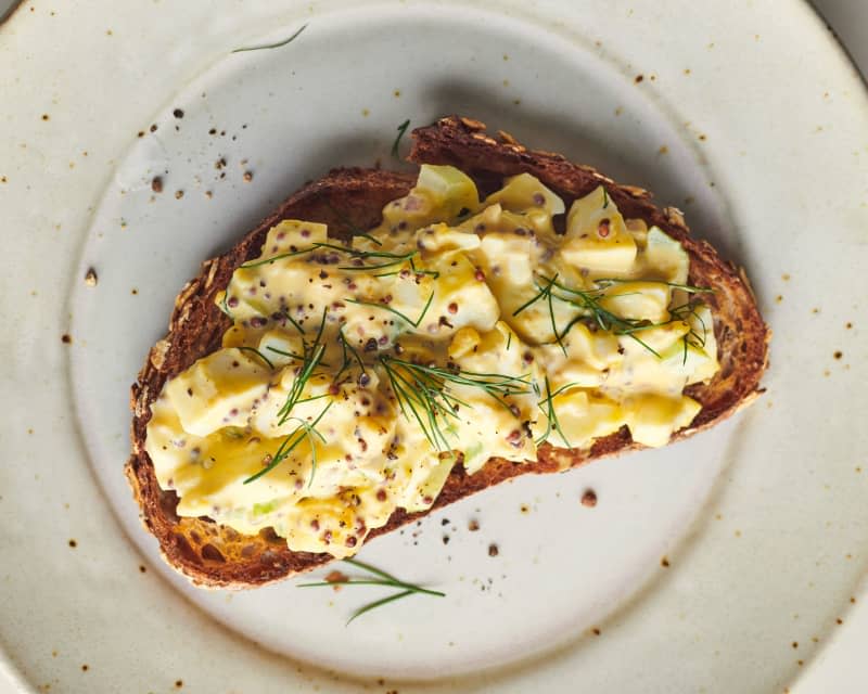 egg salad spread on toast garnished