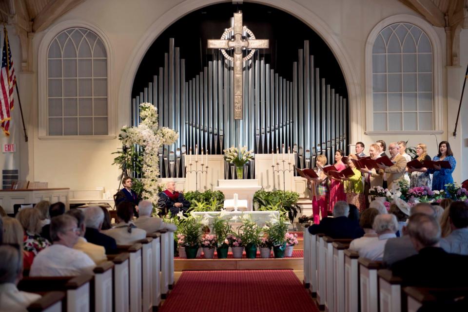 Members of the chorale sing during Easter service at The Royal Poinciana Chapel Sunday April 17, 2022 in Palm Beach. The chapel was decorated with Easter flowers by provided by church members in memory and in honor of loved ones.