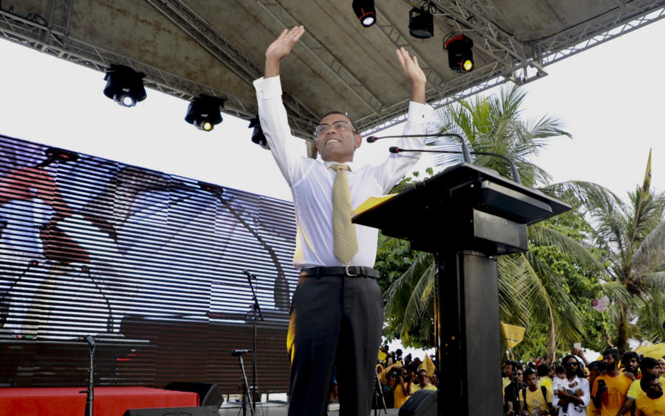 Maldives’ former president Mohamed Nasheed, gestures as he addresses the public in Male, Maldives, Thursday, Nov.1, 2018. Nasheed, the first democratically elected president of the Maldives returned home Thursday after more than two years in exile to escape a long prison term. (AP Photo/Mohamed Sharuhaan)