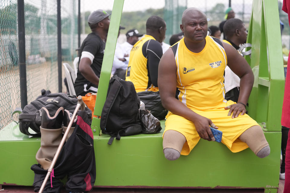 Sgt. Monday Peter whose two legs were amputated after an armored personnel carrier shattered his legs as they patroled villages in the northwestern Kaduna state in 2011, waits to take part in an exhibition sitting volleyball match in Abuja Nigeria, Saturday, May 11, 2024. (AP Photo/Sunday Alamba)