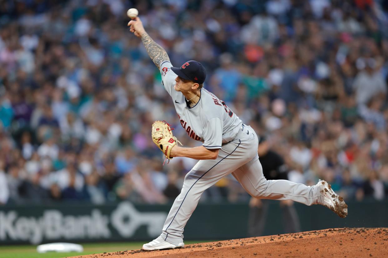 Cleveland Guardians starting pitcher Zach Plesac works against the Seattle Mariners during the first inning of a baseball game, Saturday, Aug. 27, 2022, in Seattle. (AP Photo/John Froschauer)
