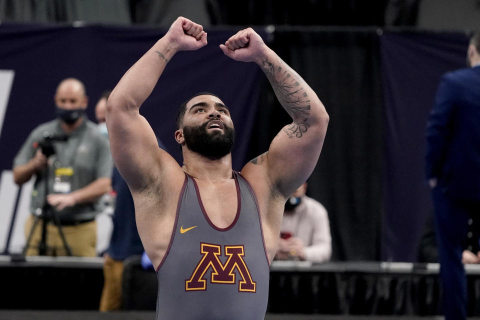 FILE - Minnesota's Gable Steveson celebrates after defeating Michigan's Mason Parris in their 285-pound match in the finals of the NCAA wrestling championships in St. Louis, in this Saturday, March 20, 2021, file photo. The NCAA heavyweight champion is brimming with confidence heading into the biggest competition of his career. His stardom was seemingly planned from the beginning — his mother named him Gable Dan -- after amateur wrestling icon Dan Gable. (AP Photo/Jeff Roberson, File)