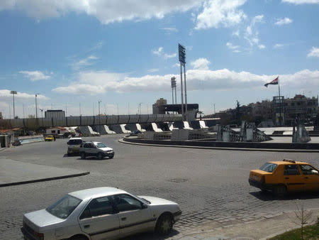 Vehicles drive at Abbasiyin square in the east of the capital Damascus, in this handout picture provided by SANA on March 20, 2017, Syria. SANA/Handout via REUTERS