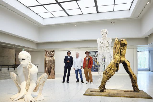 JUSSI KOIVUNEN/SARA HILDEN ART MUSEUM/AFP via Getty Nick Cave, Thomas Houseago and Brad Pitt with Pitt's art