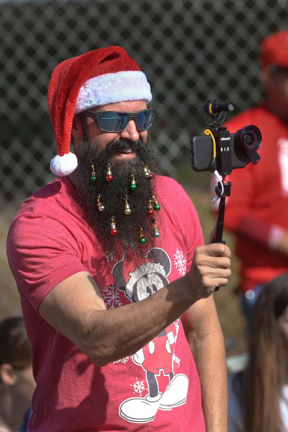 Niceville resident Joe Butler gets into the spirit of the season by decorating his beard for Saturday's Niceville Valparaiso Community Christmas Parade along John Sims Parkway and Partin Drive in Niceville.