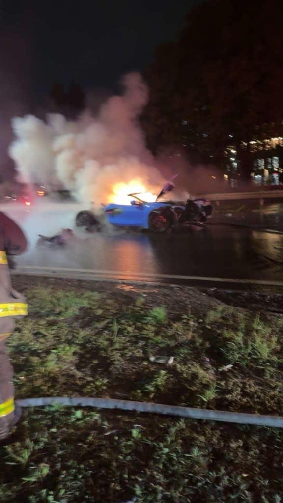 A car in flames after a crash on the Belt Parkway in Brooklyn on May 3, 2024. FDNY