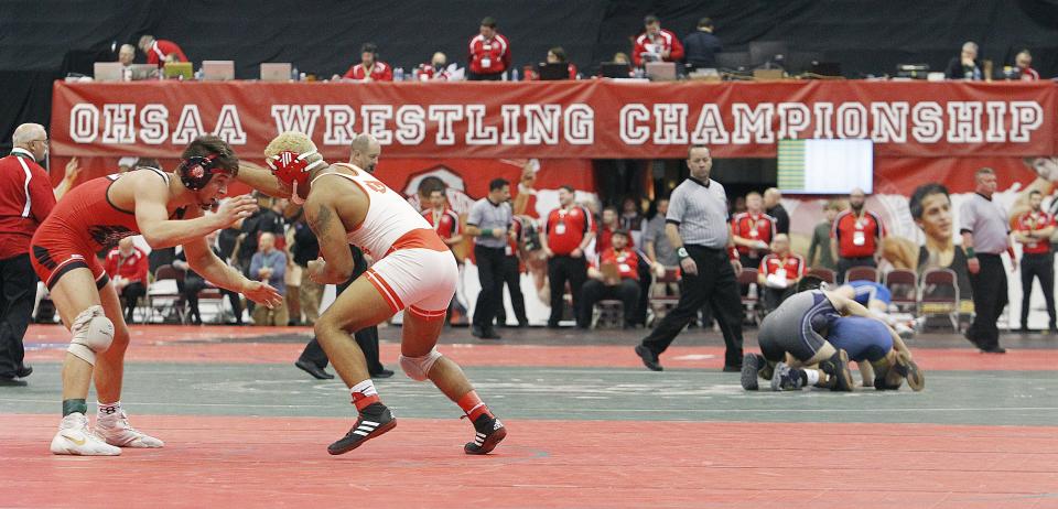 Wauseon's Connor Twigg and London's Antwaun Burns face off in the 157 weight class during the Division II Boys State Wrestling Tournament at the Schottenstein Center on March 11.