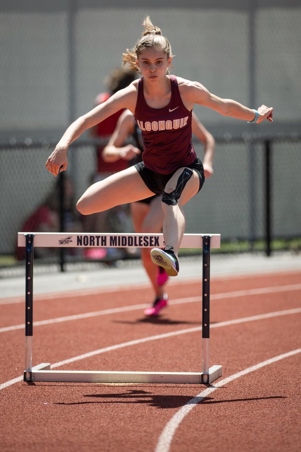 Algonquin junior Olivia LaBelle competes in the 400 hurdles during Saturday's District E Division 1 Class Championships.