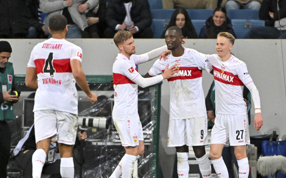 Stuttgart's Serhou Guirassy, second right, celebrates with his teammates after scoring his side's second goal during a Bundesliga soccer match between TSG 1899 Hoffenheim and VfB Stuttgart in Sinsheim, Germany, Saturday, March 16, 2024. (Jan-Philipp Strobel/dpa via AP)