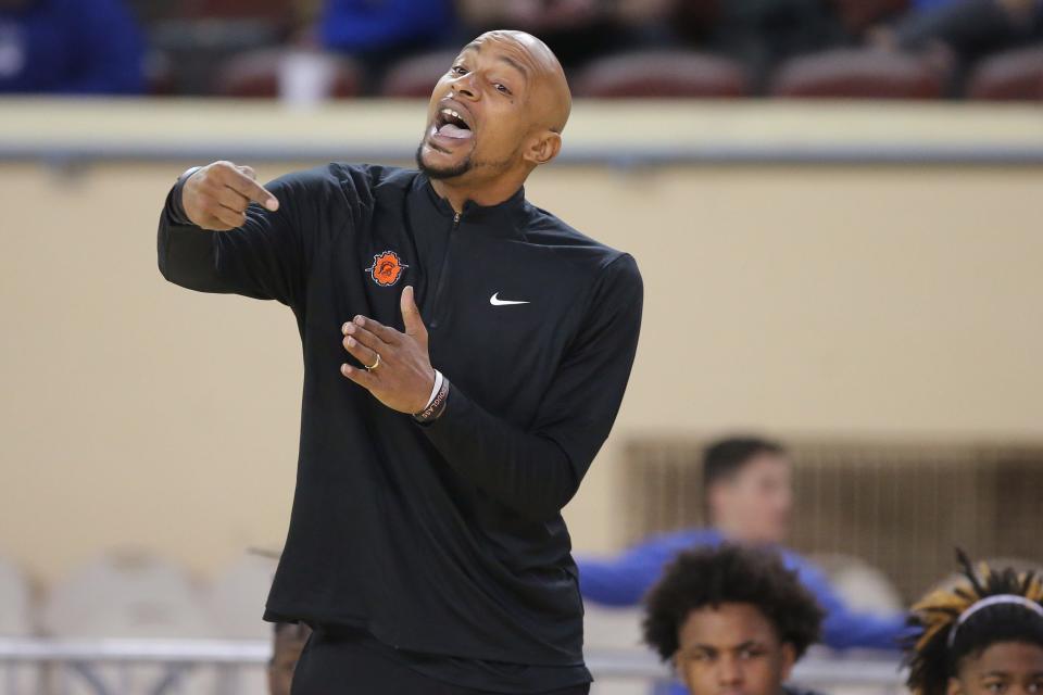 Douglass coach Steven Alexander gives instructions during a Class 4A boys state basketball quarterfinal basketball game between Douglass and Oklahoma Christian School at the State Fair Arena in Oklahoma City, Wednesday, March 8, 2023.