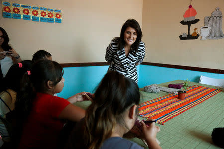U.S. Ambassador to the United Nations Nikki Haley observes children making handicrafts during a visit to El Refugio shelter, which provides care to underage victims of violence and human trafficking, in Guatemala City, Guatemala February 28, 2018. REUTERS/Luis Echeverria