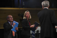 European Union Foreign Policy chief Federica Mogherini, center, UN High Commissioner for Refugees Filipo Grandi, right, and UN Migration Agency Director General Antonio Vitorino leave at the end of a joint news conference at the EU headquarters in Brussels, Tuesday, Oct. 29, 2019. The European Union says a "solidarity conference" has raised around 120 million euros ($133 million) for Venezuelans fleeing their crisis-wracked country and to help countries who are hosting them. (AP Photo/Francisco Seco)