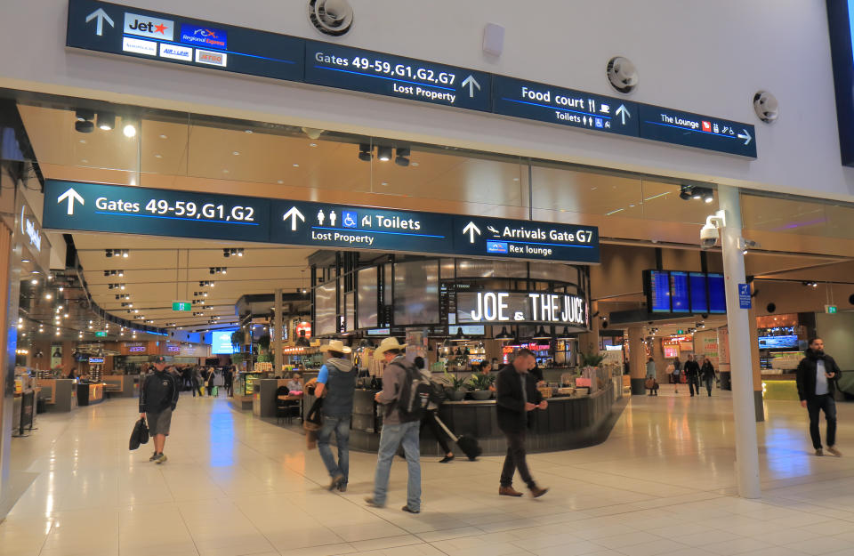 People travel at Sydney domestic airport in Sydney Australia.