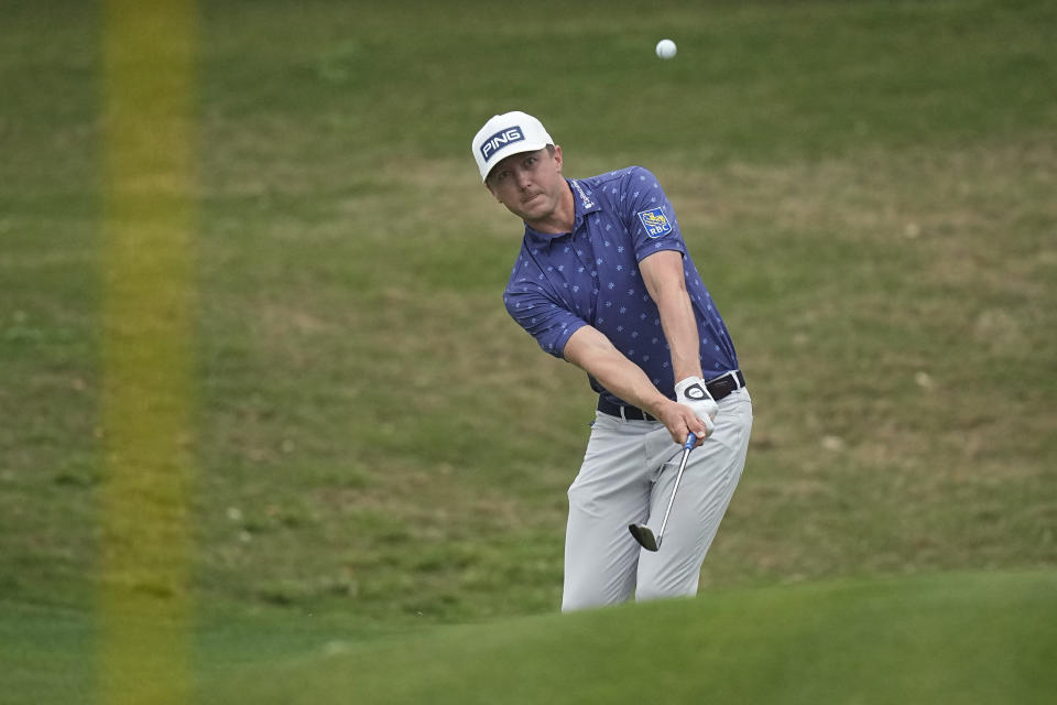 Mackenzie Hughes, of Canada, chips to the green on the fifth hole during the third round of the Dell Technologies Match Play Championship golf tournament in Austin, Texas, Friday, March 24, 2023. (AP Photo/Eric Gay)