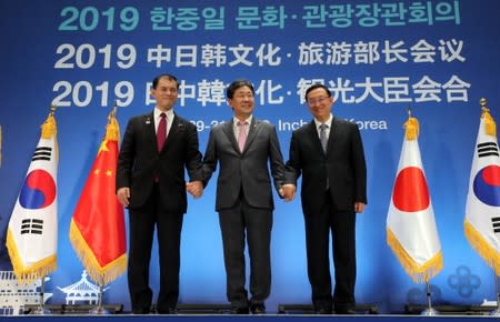 The culture ministers of Japan, South Korea and China pose during their trilateral meeting in Incheon