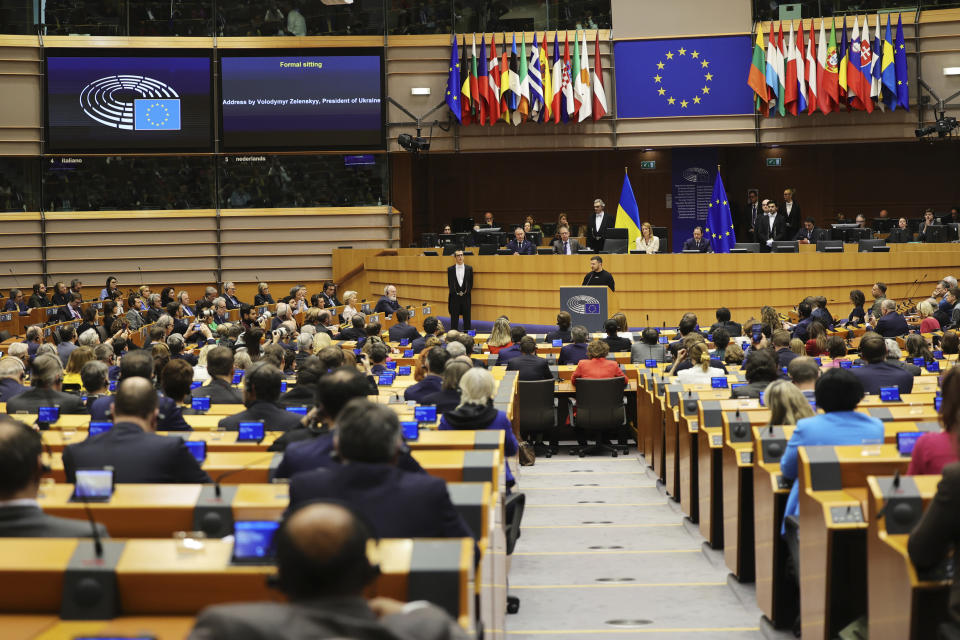 Ukraine's President Volodymyr Zelenskyy, centre, speaks during an EU summit at the European Parliament in Brussels, Belgium, Thursday, Feb. 9, 2023. On Thursday, Zelenskyy will join EU leaders at a summit in Brussels, which German Chancellor Olaf Scholz described as a "signal of European solidarity and community." (AP Photo/Olivier Matthys)