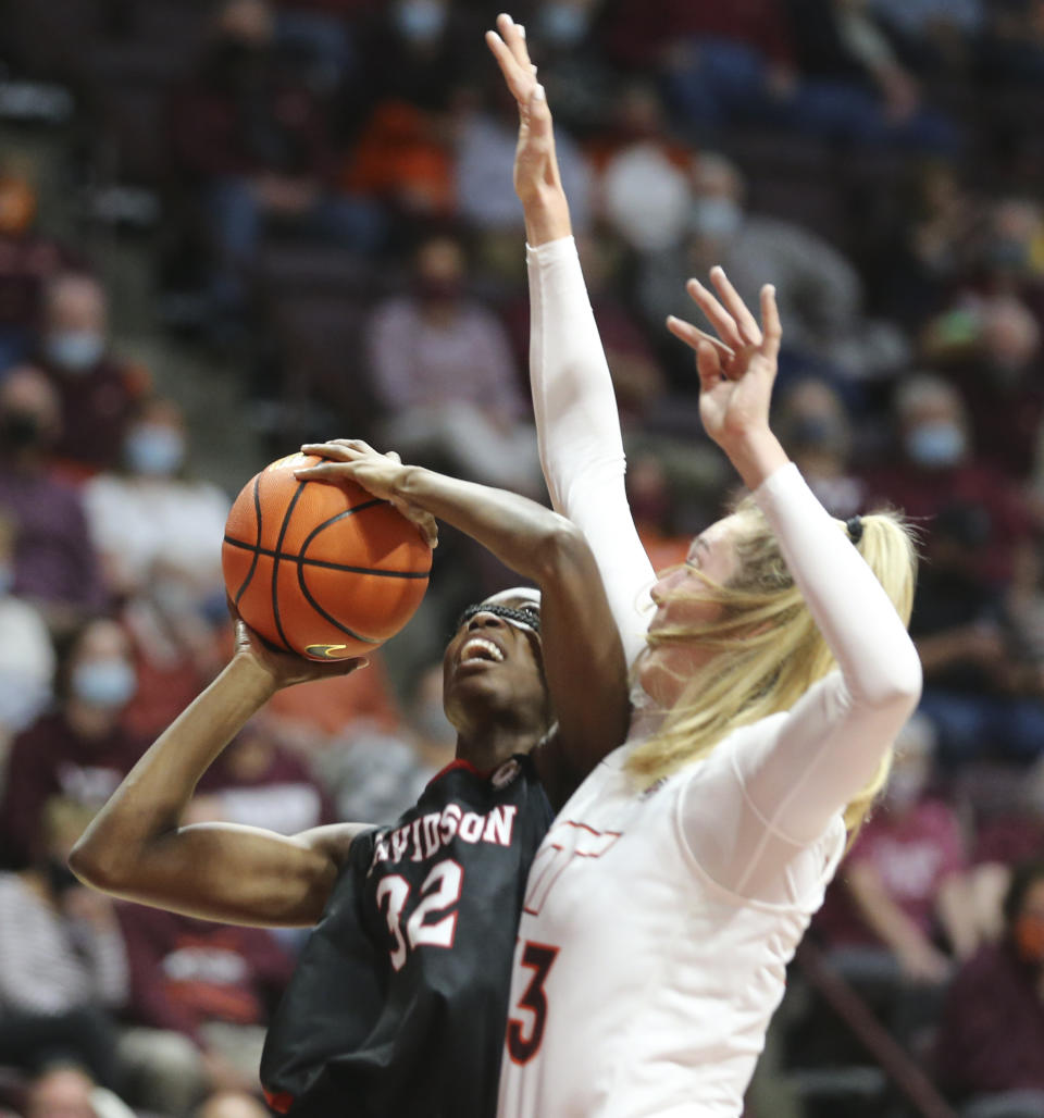 Davidson's Tomisin Adenupe (32) is fouled by Virginia Tech's Elizabeth Kitley (33) during the first half of an NCAA college basketball game in Blacksburg Va. Tuesday Nov. 9 2021. (Matt Gentry/The Roanoke Times via AP)