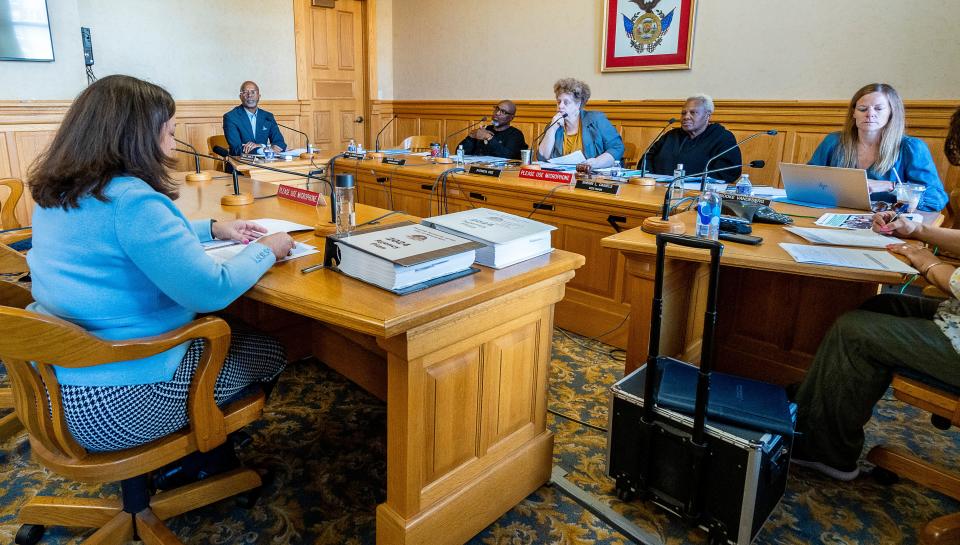 (Left) Assistant City Attorney Julie Wilson speaks in front of the Housing Authority of the City of Milwaukee (HACM) at a monthly board meeting on Wednesday September 13, 2023 at Milwaukee City Hall in Milwaukee, Wis.