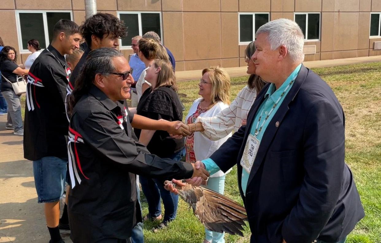 Mark Vargo, right, shakes hands with members of the Wambli Ska Society on Sept. 13, 2022, in Pierre.