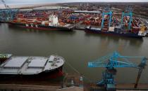 FILE PHOTO: A container ship is unloaded at Peel Ports Liverpool container terminal in Liverpool