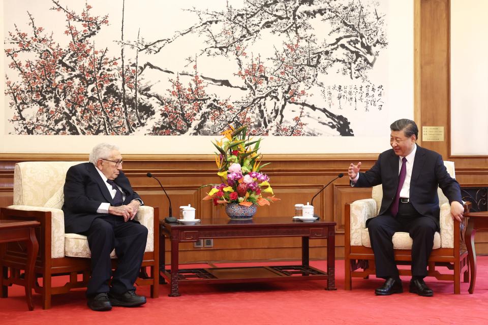 China's President Xi Jinping (R) speaks with former US secretary of state Henry Kissinger during a meeting in Beijing on July 20, 2023.