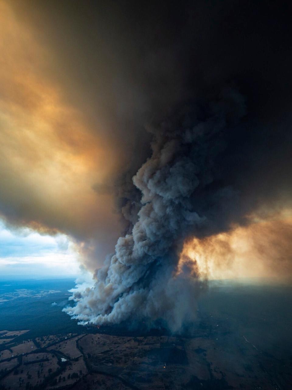 Massive smoke rises from wildfires burning in East Gippsland, Victoria, in this image from the Department of Environment, Land, Water and Planning in Gippsland, Australia.