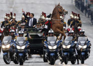 <p>A horse rears as new French President Emmanuel Macron parades in a car on the Champs Elysees after his formal inauguration ceremony in Paris, May 14, 2017. (Photo: Michel Euler/AFP/Getty Images) </p>