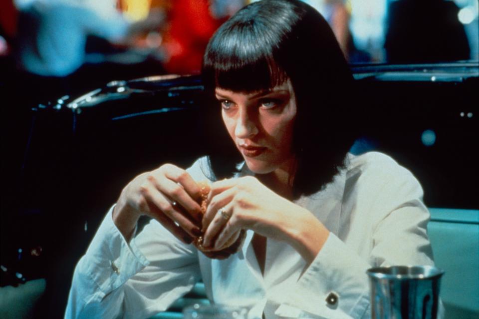 Uma Thurman holding a burger