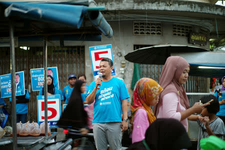 Democrat Party's candidate for Member of Parliament Anwar Salae campaigns at a market in Pattani province, Thailand, March 16, 2019. REUTERS/Panu Wongcha-um