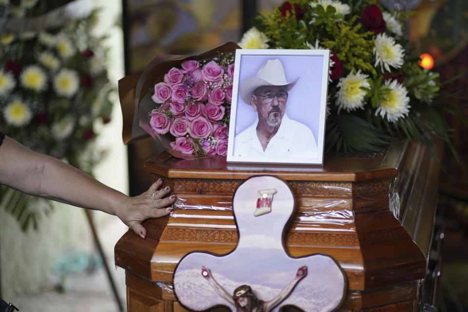 Hipolito Mora's photo sits on his casket during a wake at his home in La Ruana, Mexico, Friday, June 30, 2023. Mora, the leader of an armed civilian movement that once drove a drug cartel out of the western state of Michoacan, was killed Thursday on a street in his hometown. (AP Photo/Eduardo Verdugo)
