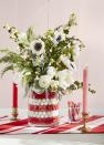 <p>Enlist your kids to help with this color-coordinated Christmas craft. </p><p><strong>To make: </strong>Begin by placing a small pillar vessel inside a larger vase, and fill the gaps between the two with red and white marbles. Then, simply fill the inner container with a mix of anemones, garden roses, and evergreen sprigs. </p><p><a class="link " href="https://www.amazon.com/CYS-EXCEL-Gemstone-Multiple-Decorative/dp/B08NV2HGPQ/ref=sr_1_4?tag=syn-yahoo-20&ascsubtag=%5Bartid%7C10050.g.644%5Bsrc%7Cyahoo-us" rel="nofollow noopener" target="_blank" data-ylk="slk:Shop Now;elm:context_link;itc:0;sec:content-canvas">Shop Now</a></p>