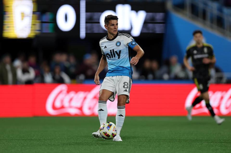 Charlotte FC midfielder Ashley Westwood (8) kicks the ball against the Columbus Crew at Bank of America Stadium.